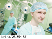 male cardiac surgeon at child cardiosurgery operating room. Стоковое фото, фотограф Дмитрий Калиновский / Фотобанк Лори
