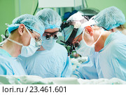 male cardiac surgeon at child cardiosurgery operating room. Стоковое фото, фотограф Дмитрий Калиновский / Фотобанк Лори