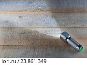 Bright LED flashlight shines. Стоковое фото, фотограф Alexander / Фотобанк Лори