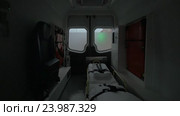 Internal view of a modern ambulance car riding on the street. Interior, modern special equipment, seat and stretcher. Стоковое видео, видеограф Данил Руденко / Фотобанк Лори