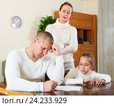 Sad family with documents having problems. Стоковое фото, фотограф Яков Филимонов / Фотобанк Лори