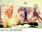 Crying outcast student in college classroom. Стоковое фото, фотограф Яков Филимонов / Фотобанк Лори