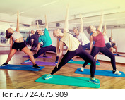 Happy adults having group fitness class. Стоковое фото, фотограф Яков Филимонов / Фотобанк Лори