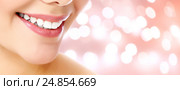 Woman smile closeup against an abstract background. Стоковое фото, фотограф Nobilior / Фотобанк Лори