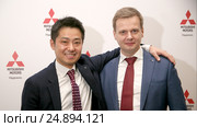 Пресс-конференция официального дистрибьютора автомобилей Mitsubishi на территории России, Казахстана и  Белоруссии - компания «ММС Рус» (Mitsubishi Motors). Накамура Наоя и Андрей Кочетков. (2017 год). Редакционное фото, фотограф Александр С. Курбатов / Фотобанк Лори