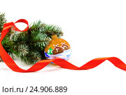 Artificial fir-tree branch with a ball, a background for New year and Christmas on a white background (2016 год). Редакционное фото, фотограф Artem Sobov / Фотобанк Лори
