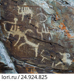 Hunting scenes palaeolithic Petroglyphs. Стоковое фото, фотограф TasiPas / Фотобанк Лори