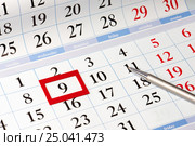 Date highlighted in red on calendar with black numbers next to t. Стоковое фото, фотограф Сергей Федулов / Фотобанк Лори