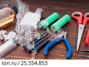Check RDA. Set to vape. Tools, cotton, liquid, RDA, RTA. Стоковое фото, фотограф Сергей Лабутин / Фотобанк Лори