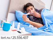 Sick man with flu lying in the bed. Стоковое фото, фотограф Elnur / Фотобанк Лори