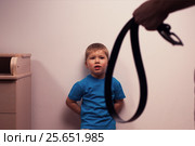 Female hand with belt on the background of kid. Стоковое фото, фотограф Pavel Biryukov / Фотобанк Лори