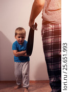 Little scared son and aggressive parent with belt. Стоковое фото, фотограф Pavel Biryukov / Фотобанк Лори