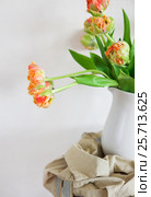 Tulips bouquet in white vase on wooden rustic chair. Стоковое фото, фотограф Дарья Петренко / Фотобанк Лори