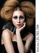 Beauty portrait of young woman with fashion makeup with rhinestones touching her face. Studio shot. Carnival or party makeup. Стоковое фото, фотограф Людмила Дутко / Фотобанк Лори