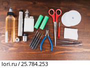 Set to vape. Tools, candy, liquid, RDA, RTA. Стоковое фото, фотограф Сергей Лабутин / Фотобанк Лори