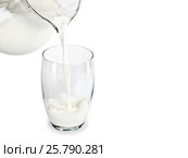 Filling of a glass by milk from a glass jug. Стоковое фото, фотограф Андрей Есин / Фотобанк Лори