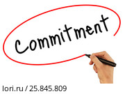 Man Hand writing Commitment with black marker on visual screen. Стоковое фото, фотограф Плотников Дмитрий / Фотобанк Лори