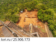 A view down the stairs of Sigiriya Rock or Lion Rock, a World Heritage Site near Dambulla, Sri Lanka. Стоковое фото, агентство BE&W Photo / Фотобанк Лори