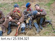 Volgograd, Russia - November 21, 2010: Portrait of re-enactors dressed as Russian Soviet soldier of World War II in military-historical reconstruction in Volgograd. The battle of Stalingrad. Редакционное фото, фотограф Юлия Олейник / Фотобанк Лори