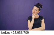 Thinking woman at lilac background. Стоковое видео, видеограф Илья Шаматура / Фотобанк Лори