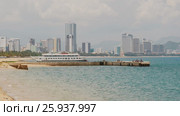 Coast of Nha Trang city with berth and tourist ship. Стоковое видео, видеограф Mikhail Davidovich / Фотобанк Лори