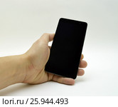 Black smartphone in hand. Стоковое фото, фотограф Дмитрий Родин / Фотобанк Лори