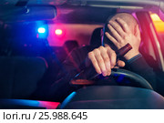 Sad man is caught driving under alcohol influence. Стоковое фото, фотограф Pavel Biryukov / Фотобанк Лори
