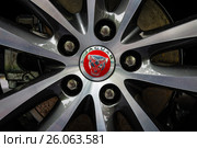 BERLIN - JUNE 14, 2015: The front brake system of a compact executive car Jaguar XE 20D (since 2015). The Classic Days on Kurfuerstendamm. Редакционное фото, фотограф Sergey Kohl / Фотобанк Лори