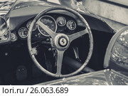 BERLIN - JUNE 14, 2015: Cockpit of a sports car Ferrari 500 TR, 1956. Black and white. Stylization. The Classic Days on Kurfuerstendamm. Редакционное фото, фотограф Sergey Kohl / Фотобанк Лори