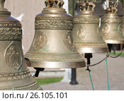 Church orthodox bells, Four bells arranged in one row, on a sunny bright day. Стоковое фото, фотограф Evgenii Mitroshin / Фотобанк Лори
