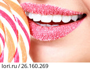 Closeup of woman's lips covered by sugar and big lollypop. Стоковое фото, фотограф Nobilior / Фотобанк Лори