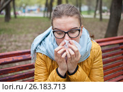Молодая женщина с носовым платком на улице. Стоковое фото, фотограф Victoria Demidova / Фотобанк Лори