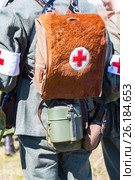 Unidentified re-enactors dressed as German military paramedic with a red cross brassard and medical bag. Стоковое фото, фотограф FotograFF / Фотобанк Лори