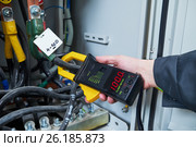 electrician measurements with multimeter tester. Стоковое фото, фотограф Дмитрий Калиновский / Фотобанк Лори