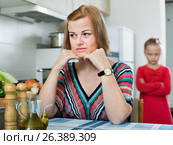 Upset girl and mother have a peeve on each other. Стоковое фото, фотограф Яков Филимонов / Фотобанк Лори