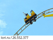 SOCHI, RUSSIA – June 18, 2017: People ride on the family "roller coaster" "Sharolet" in Sochi Park, which entered the TOP-25 of the best parks in Europe in 2016. Редакционное фото, фотограф Анна Мартынова / Фотобанк Лори