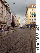 MUNICH, GERMANY - May 29, 2012: People walking through Theatinerstrasse with view onTheatine Church of St. Cajetan (Theatinerkirche St. Kajetan) Редакционное фото, фотограф Куликов Константин / Фотобанк Лори