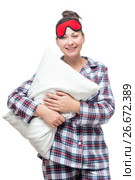Woman in clothes for sleep with a pillow in hands on a white background. Стоковое фото, фотограф Константин Лабунский / Фотобанк Лори