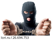 Arrested criminal shows hands in handcuffs. Стоковое фото, фотограф Константин Лабунский / Фотобанк Лори