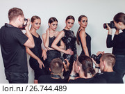 Photographers paparazzi take photos of women in cocktail dresses. Стоковое фото, фотограф Женя Канашкин / Фотобанк Лори