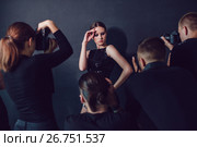 Photographers paparazzi take photos of beautiful woman in cocktail dresses. Стоковое фото, фотограф Женя Канашкин / Фотобанк Лори