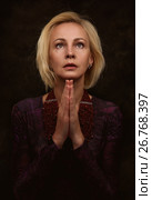 Woman praying with hands together. Стоковое фото, фотограф Александр Лычагин / Фотобанк Лори