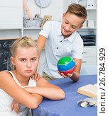 Boy is excusing for the offendedly girl and offering to play ball. Стоковое фото, фотограф Яков Филимонов / Фотобанк Лори