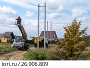 Установка и монтаж опор линии электропередач (2016 год). Редакционное фото, фотограф Владимир Макеев / Фотобанк Лори