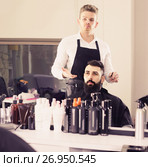 client feeling discontent about his new haircut at hair salon. Стоковое фото, фотограф Яков Филимонов / Фотобанк Лори