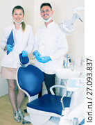 Orthodontist in white with his assistent are meeting next client near the chair. Стоковое фото, фотограф Яков Филимонов / Фотобанк Лори