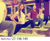 Adults having group fitness class. Стоковое фото, фотограф Яков Филимонов / Фотобанк Лори