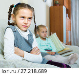 Offended girls sitting apart at home. Стоковое фото, фотограф Яков Филимонов / Фотобанк Лори