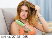 Girl in a panic because her hair falls out. Стоковое фото, фотограф Яков Филимонов / Фотобанк Лори