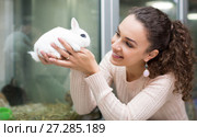 Portrait of young happy woman holding rabbit. Стоковое фото, фотограф Яков Филимонов / Фотобанк Лори